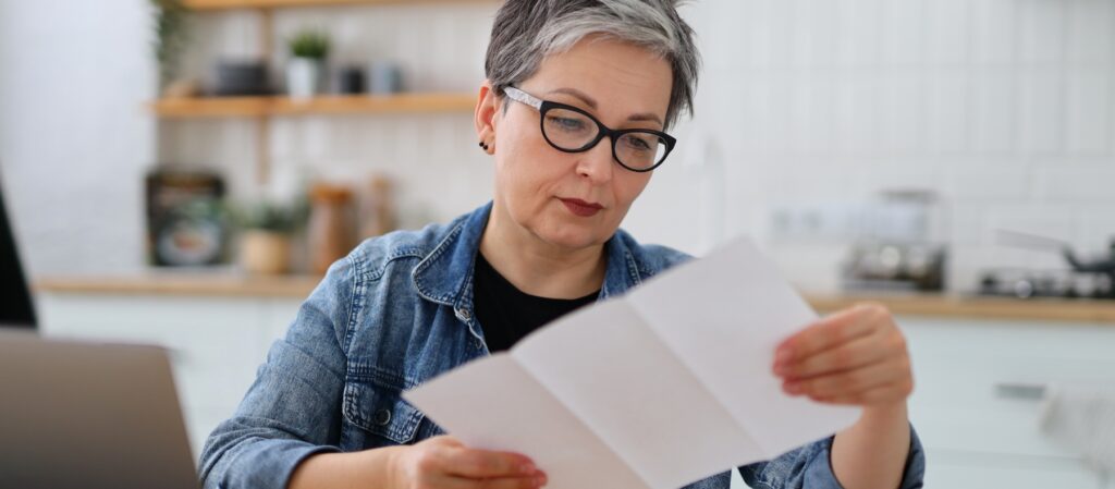 A woman reviewing medical paperwork