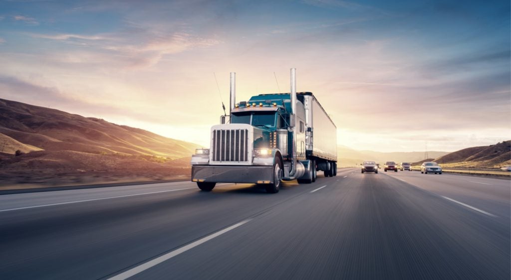 A commercial truck driving on the highway