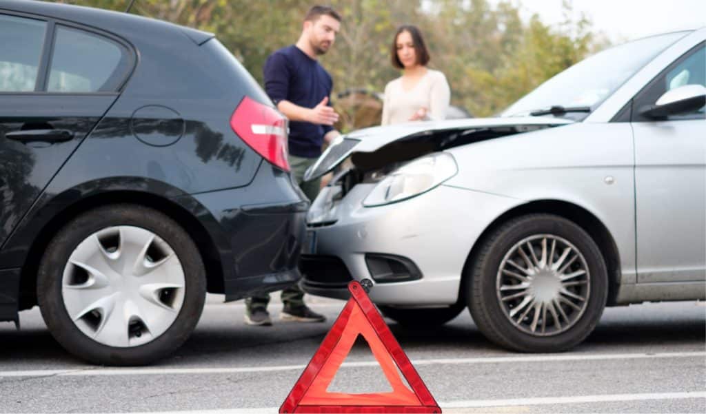 Side view of a car crash between two vehicles