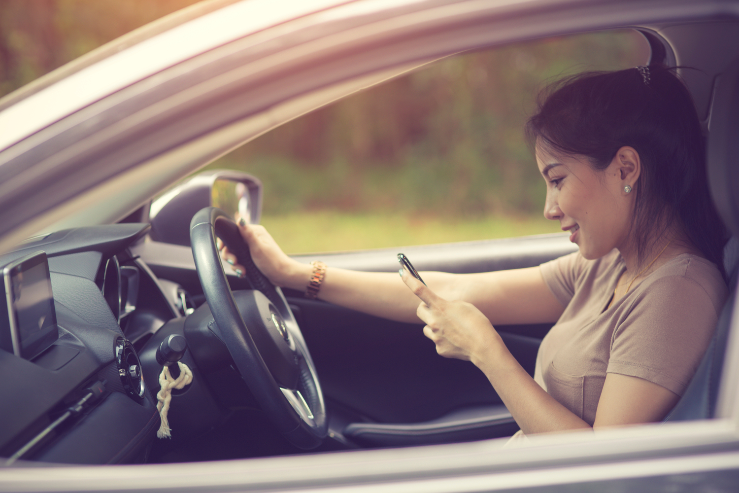 Woman texting while driving