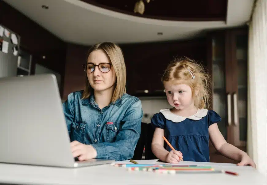 A mother and a child working together at a desk
