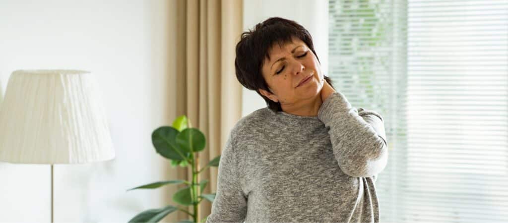A woman experiencing neck pain