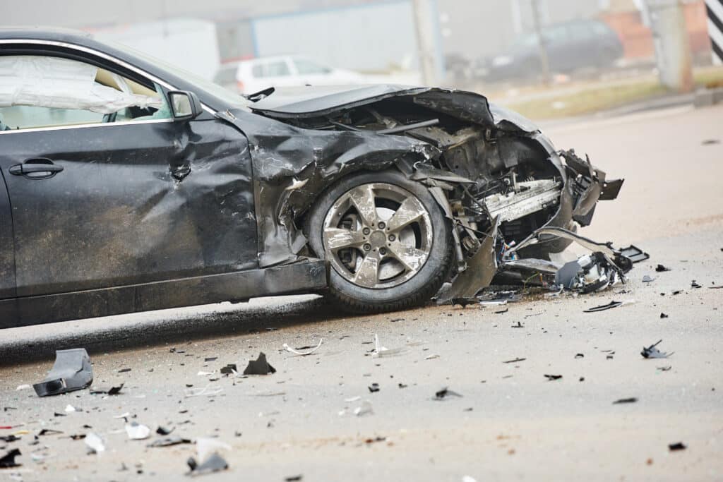 car crash accident or collision in city on street, damaged automobile